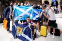 Scotland fans at Central station in Glasgow as they prepare to travel to London ahead of the UEFA Euro 2020 Group D match between England and Scotland.