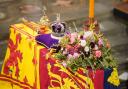 The coffin of Queen Elizabeth II, draped in the Royal Standard