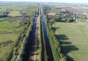 Work to install a temporary flood barrier on the A1101 Welney Wash Road will mean there will be two-way traffic lights and a full road closure over the next few months.