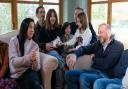 Mick Swinhoe (right) talks to Valeriia Starkova and her family as they settle into their new home in Caldecote near Cambridge, which the four-generation family of 10 moved into last week after they fled Kharkiv in the Ukraine following the Russian