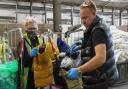 Ross Taylor (right) helping out inside Ukraine Lifeline's main warehouse in Pymoor.