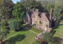 The property's extensive grounds include a large walled garden, a tennis court, paddock and deciduous trees.