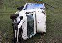 A van left on the side of the road after being blown down a verge in to a field at Forty Foot in Ramsey.