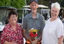 Frank Howard (centre) with the winners' trophy alongside John Gamble's wife Jill and his daughter Katie.