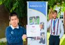 Xiang Lin (L) and his certificate after he was long-listed as part of the National Theatre's annual playwrighting competition. Literacy lead at Marshland High School, Joe Clark (R), is pictured with Xiang.