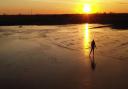 Adam Giles captured drone footage of his daughter Alesya skating at sunrise over a frozen wheat field that flooded in Welney.