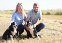 Norfolk County Farms tenants Tom Martin and Hannah Hetherington with their dogs at Mendhams Farm in Outwell, near Wisbech