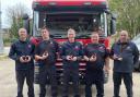 The firefighters with their Coronation Medals.