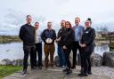 Staff members with the Red Rose Award