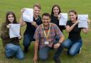 Students at Marshland High School celebrating after collecting their GCSE results