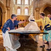 Princess Anne unveils the Fenland Black Oak Table, a 13m-long table made from a 5,000-year-old tree unearthed in Southery, Norfolk, in 2012