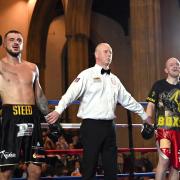 Joe Steed's hand is raised in victory by referee Mark Bates