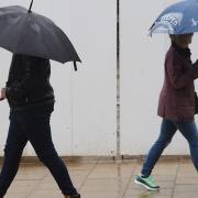 Chance of rain this August bank holiday weekend. File photo of umbrellas up in the rain and wind in Norwich. Picture: DENISE BRADLEY.