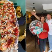 It's finally arrived: A 70cm pizza, home made, and created by Maria and Peppe (right) at Vesuvio, Whittlesey. The couple are pictured celebrating their 10th anniversary running the restaurant last October.