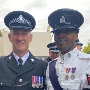 Inspector Matt Snow (L) attended the Queen's funeral on September 19, representing Cambridgeshire Constabulary. He's pictured with an officer from Montserrat.