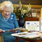 Queen Elizabeth II with memorabilia from her Golden and Platinum Jubilees at Windsor Castle