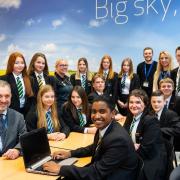 Three groups of pupils at Thomas Clarkson Academy pitched to a 'Dragons' Den' style panel for £1,000 of funding for a new sports club. Pictured with the students is principal Richard Scott (L).