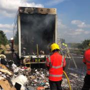 Fire crews clearing up after the lorry fire at Milton on the A14