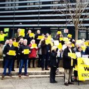 Campaigners gathered outside The Boathouse Business Centre in Wisbech where public hearings into plans to build an incinerator will take place.