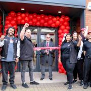 Deputy Mayor Cllr Peter Human cutting the ribbon on Wendy's in Wisbech.