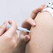 Stock photo of a Covid booster vaccine being administered.