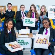 The bake sale in November was organised by student Lia, who is seated on the left in this photo.