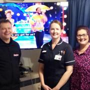 Left to right: David Youngs, manager of the Hughes Electrical store in Wisbech's Horsefair Shopping Centre, Alan Hudson Day Treatment Centre matron Michelle Knight and fundraising manager Toni Bird, with the new TV.