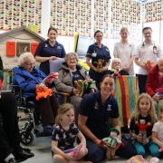 Avice (left), a resident at Hickathrift House Care Home near Wisbech, visited the Rudham Ward at Queen Elizabeth Hospital to donate teddy bears she had knitted for children.