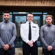 Chief Superintendent Jon Hutchinson with players James Brophy and Macauley Bonne.