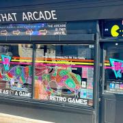 Creative People and Places: MarketPlace artist Cary Outis has transformed the windows of town centre shops with chalk pen dragon drawings ahead of next weekend's St George's Festival. This is his design for Tap That arcade.