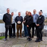 Staff members with the Red Rose Award