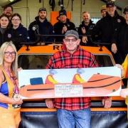 Stacey O'Donnell, front left, with Vic Dade, who piloted the hovercraft with rescued her three daughters, Stormy Stan and the Hunstanton RNLI crewStacey O'Donnell, front left, with Vic Dade, who piloted the hovercraft with rescued her three daughters,