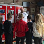 Joe Gacon, water safety and arson liaison officer at Cambridgeshire Fire and Rescue, talks to pupils about staying safe in water.