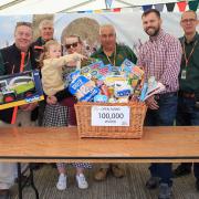 100,000th visitor to the Open Farm Sunday event at Park Farm Thorney. Host farmer Michael Sly is pictured second from the left.