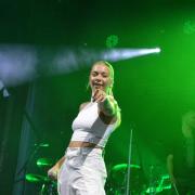 Becky Hill performing at Newmarket Racecourse.