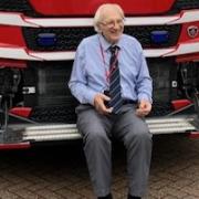 Wally, 91, in front of a fire engine in Wisbech