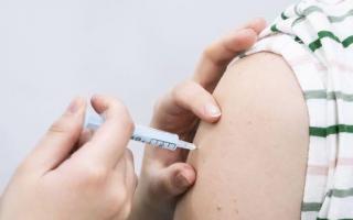 Stock photo of a Covid booster vaccine being administered.