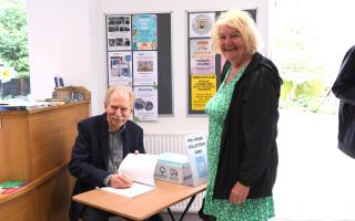 Andrew Ketley signing copies of Volume 6 at the launch.