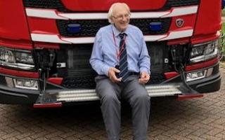 Wally, 91, in front of a fire engine in Wisbech